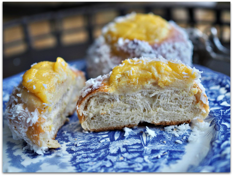 Skoleboller (Norwegian buns with custard & coconut)on a plate