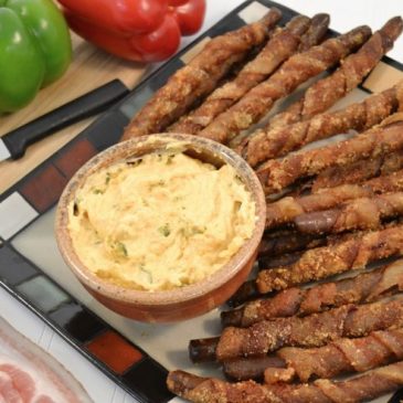 Bacon wrapped pretzel rods with cheese dip and Rada Cutlery